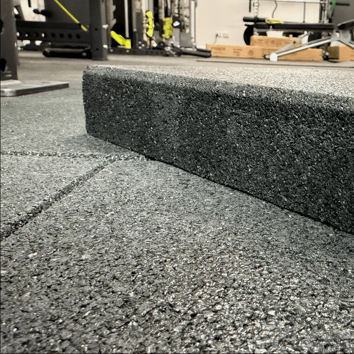 Close-up side view showing 50mm thickness of Armoured Armadillo gym flooring tile – high-density shock-absorbing rubber