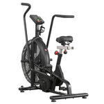 A black indoor exercise bike with a large front fan, digital display screen, padded seat, and adjustable handlebars, shown on a plain white background.