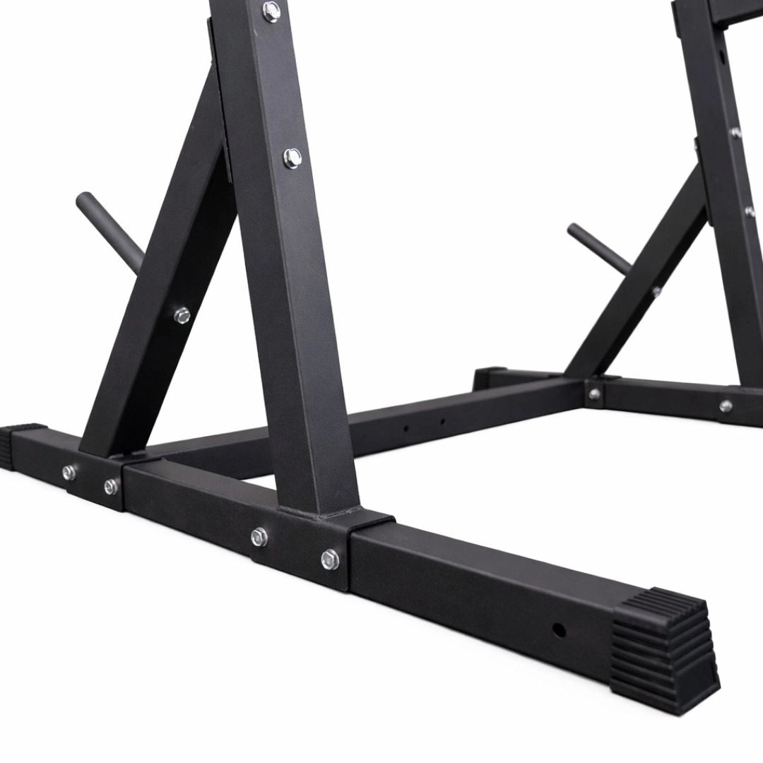 Close-up of the welded H-design base on a black Commercial Half Squat Rack, showing the heavy-duty 60mm steel tubing and reinforced floor stability.