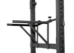 ['Elite Commercial Power Rack front view', 'Power rack with multi-grip pull-up bar', 'Heavy-duty J-hooks and safety bars', 'Adjustable tricep dip station included', 'Full rack setup in home gym environment']