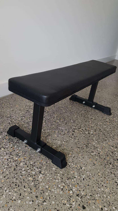 Flat bench for home gym workouts – compact strength training bench Australia, Flat workout bench in home gym setup for full-body strength training